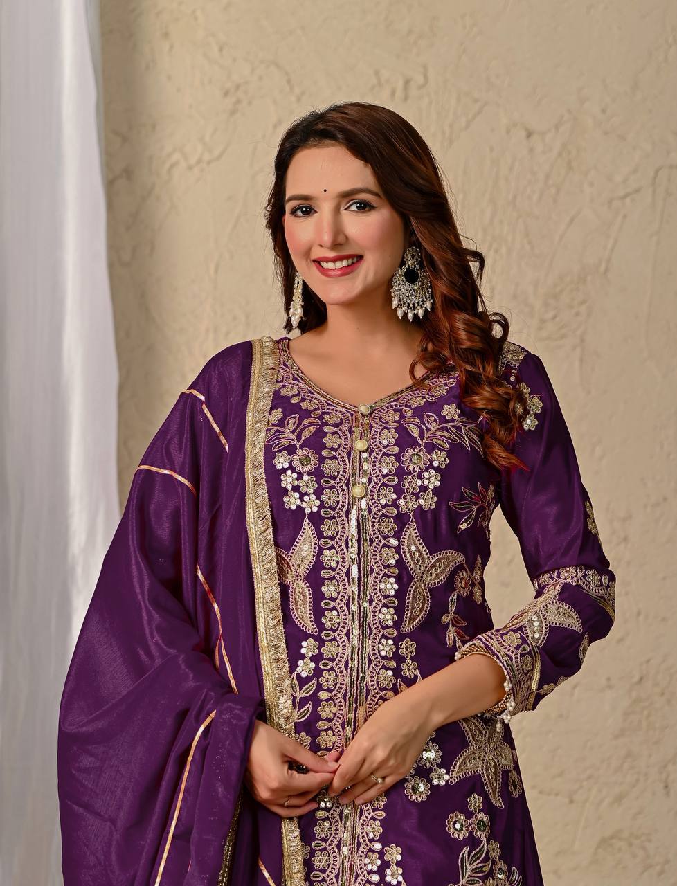 Regal Wine Purple Kurti and Flared Palazzo Suit Set Embellished with Intricate Floral Zari and Mirror Work